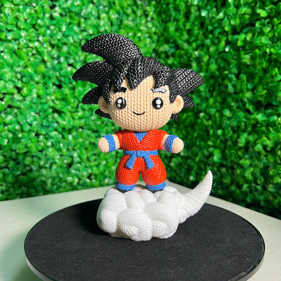 Goku impresso em 3D com textura de crochê sobre a nuvem voadora